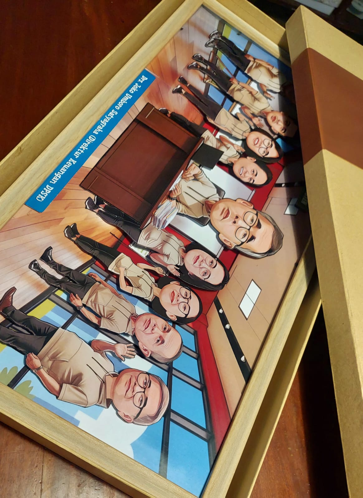 Framed office group caricature
